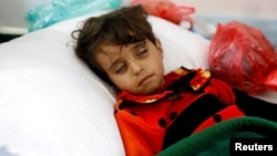 A girl infected with cholera rests at a hospital in Sanaa, Yemen, May 7, 2017.