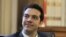 Greek leader of Coalition of the Radical Left party (SYRIZA) Alexis Tsipras looks on during a meeting with Greek President Karolos Papoulias, to formally take the mandate to form a coalition government in Athens. 