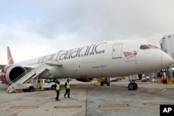 Virgin Atlantic Flight100 arrives at John F. Kennedy International Airport, Tuesday, Nov. 28, 2023 in New York. (Jason DeCrow/AP Images for Virgin Atlantic Airways Ltd)