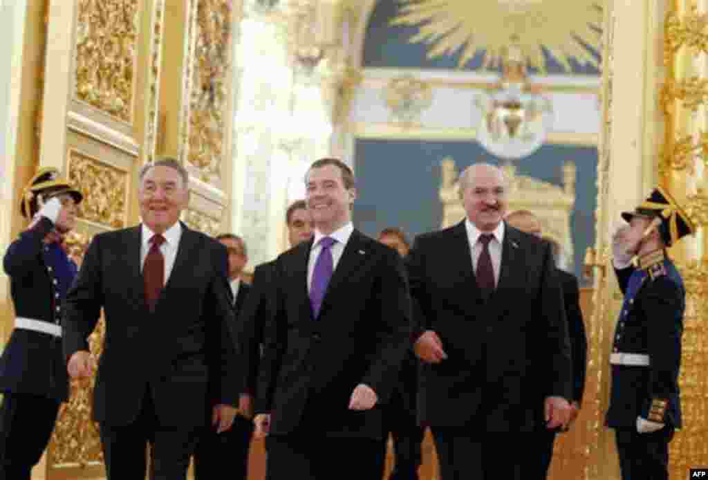 Russian President Dmitry Medvedev, center, Belarusian President Alexander Lukashenko, right, and Kazakh President Nursultan Nazarbayev, left, enter a hall before a summit of the Collective Security Treaty Organization in the Kremlin in Moscow, Tuesday, D