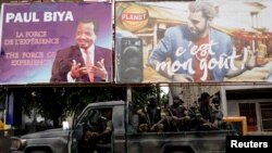 Cameroonian elite Rapid Intervention Battalion (BIR) members sit on their military vehicle during a patrol in the souhwest city of Buea, Cameroon, Oct. 4, 2018.