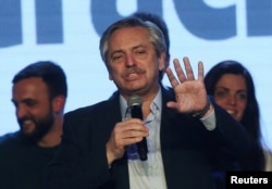 Presidential candidate Alberto Fernandez speaks during the primary elections, at a cultural center in Buenos Aires, Argentina, Aug. 11, 2019.