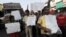 People hold placards as they campaign against nuclear power plants in Mumbai, India, April 26, 2012.