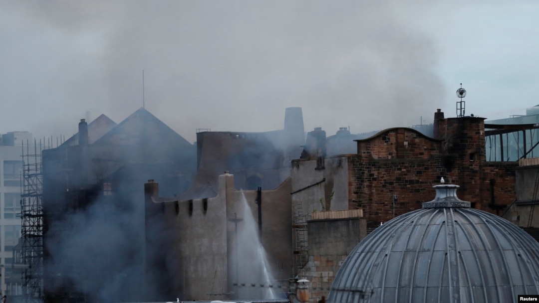 Firefighters attend to a blaze at the Mackintosh Building at the Glasgow School of Art for the second time in four years, Glasgow, Scotland, June 16, 2018.