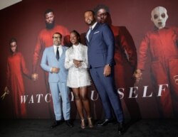 FILE - Director Jordan Peele, left, and actors Lupita Nyong'o, center, and Winston Duke attend the "Us" premiere at The Museum of Modern Art in New York City, New York, March 19, 2019.