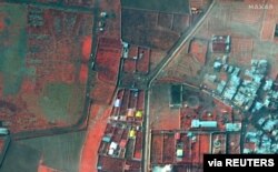 A color-infrared view shows the area where an Ukraine International Airlines plane crashed after takeoff from Iran's Imam Khomeini airport, on the outskirts of Tehran, Maxar's WorldView-2 satellite image taken Jan. 9, 2020.