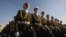 FILE - Afghan National Army cadets march during a graduation ceremony at National Military Academy of Afghanistan in Kabul, Afghanistan, Tuesday, March 16, 2010.