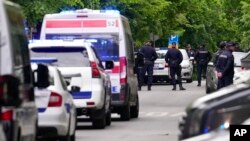 Police block streets around the Vladislav Ribnikar school in Belgrade, Serbia, May 3, 2023.