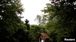 A traditional Ainu hut stands in the grounds of Nibutani Ainu Museum in Biratori, Hokkaido Prefecture, Japan, Aug. 23, 2019.