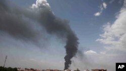 FILE - Smoke rises over Khartoum, Sudan, on June 8, 2023, as fighting between the Sudanese army and paramilitary Rapid Support Forces continues. 