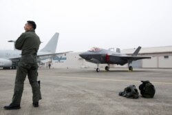 A South Korean fighter pilot stands near F-35 A Stealth in the 71st anniversary of Armed Forces Day at the Air Force Base in Daegu, South Korea, Oct. 1, 2019.