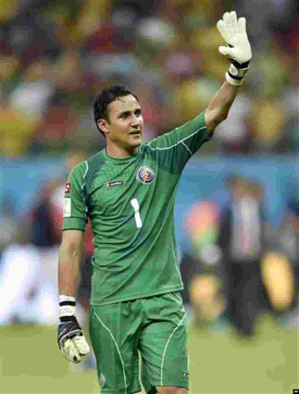 Costa Rica's goalkeeper Keylor Navas waves to supporters after Costa Rica defeated Greece 5-3 in penalty shootouts after a 1-1 tie during the World Cup round of 16 soccer match between Costa Rica and Greece at the Arena Pernambuco in Recife, Brazil, Sunda