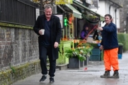A passerby gestures to journalist and television presenter Piers Morgan, after he left his high-profile breakfast slot with the broadcaster ITV, following his long-running criticism of Prince Harry's wife Meghan, in London, Britain, March 10, 2021.