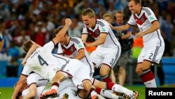 FILE - Germany players celebrate after winning the 2014 World Cup at the Maracana stadium in Rio de Janeiro, July 13, 2014. 