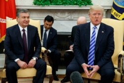 FILE - President Donald Trump (R) speaks during a meeting with Uzbek President Shavkat Mirziyoyev in the Oval Office of the White House, in Washington, May 16, 2018.