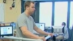 Rob Summers, paralyzed below the chest, can stand and take steps with an experimental treatment