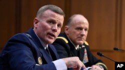 Gen. Tod D. Wolters, commander of U.S. European Command and NATO Supreme Allied Commander Europe, left, and Gen. Stephen Lyons, commander, U.S. Transportation command, right, testify before the Senate Armed Services Committee hearing, Feb. 25, 2020.