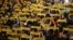 People hold banners reading "Freedom Political Prisoners" gather in support of the members of the dismissed Catalan cabinet after a Spanish judge ordered the former Catalan leaders to be remanded in custody pending an investigation into Catalonia's independence push, outside Barcelona's town hall, Nov. 3, 2017.
