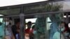 People wearing protective face masks are seen inside a bus in Ashgabat, Turkmenistan, July 15, 2020. (REUTERS/Vyacheslav Sarkisyan)