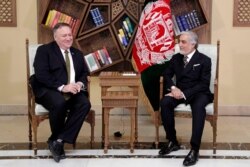 U.S. Secretary of State Mike Pompeo, left, meets with Abdullah Abdullah the main political rival of President Ashraf Ghani at the Sepidar Palace, in Kabul, Afghanistan, March 23, 2020.