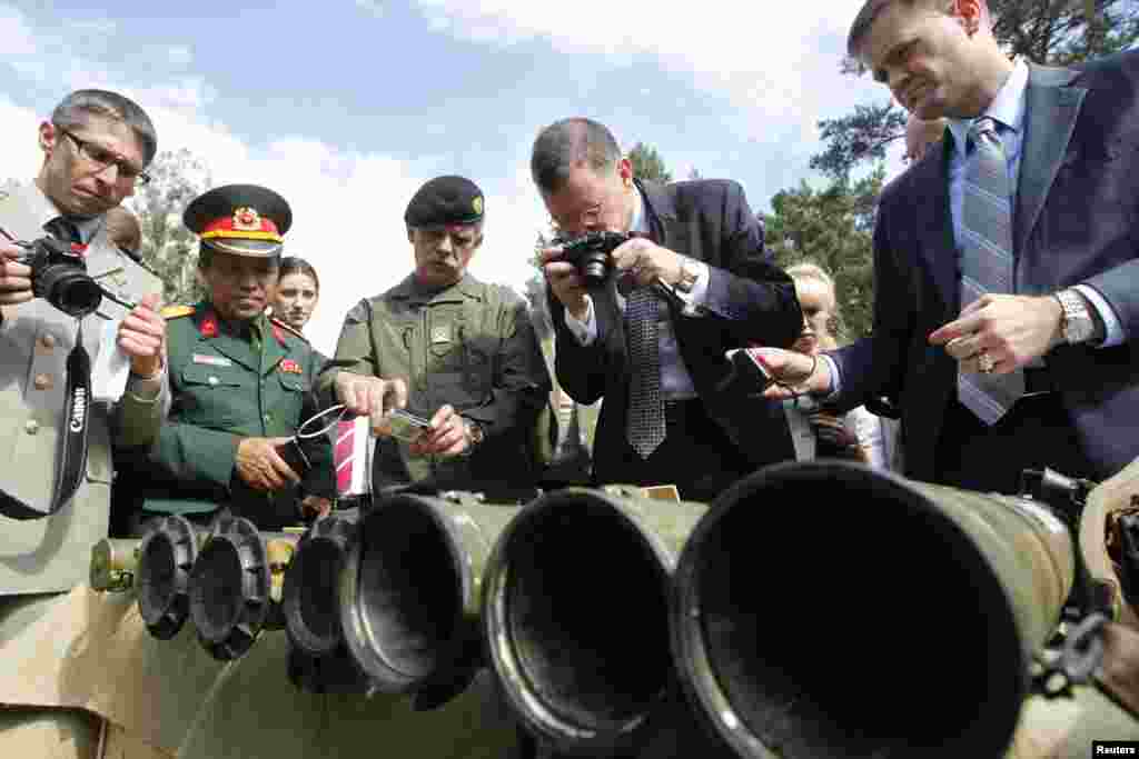 Foreign military attaches and media look at grenade launchers seized from pro-Russian separatists in the eastern regions of Ukraine, Aug. 29, 2014.&nbsp;