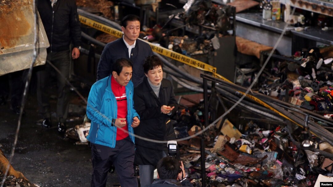 FILE - South Korean President Park Geun-hye visits the scene of a fire at a traditional market in Daegu, South Korea, Dec. 1, 2016.