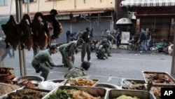 Thai security personnel collect evidence as they investigate at the site of a bomb attack in the southern Yala province, Feb. 21, 2011.