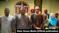  President Muhammadu Buhari commissions the Nigeria Immigration centre accompanied by Consul General, Mrs Uche Ajulu-okeke and Acting High Commissioner Mr. Martins Cobham as he meets with Nigerian community at the Nigeria Consulate in Johannesburg, South