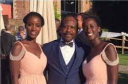 Paul Rusesabagina is pictured with his daughter, Carine Kanimba, left, and her sister. (Carine Kanimba/Facebook)