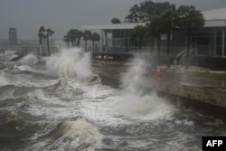 Waves crash along St. Pete Pier in St. Petersburg, Florida, as Hurricane Milton is expected to make landfall on Oct. 9, 2024.