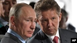 Президент Росії Володимир Путін, голова "Газпрому" Олексій Міллер