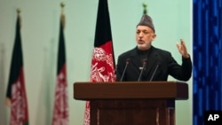 Afghan President Hamid Karzai speaks as he inaugurates Loya Jirga, grand assembly in Kabul, November 16, 2011.