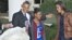 President Barack Obama, with daughters Sasha (l) and Malia carries on the Thanksgiving tradition of saving a turkey from the dinner table with a "presidential pardon," Nov. 21, 2012, in the Rose Garden of the White House.