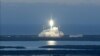 FILE - This NASA handout file photo taken Feb. 11, 2015, shows NOAA's DSCOVR satellite launching from Cape Canaveral Air Force Station in Florida. A chunk of a SpaceX rocket that blasted off seven years ago and was abandoned in space after completing its 