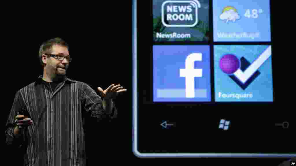 Aaron Woodman, Microsoft's director of their Mobile Communications Business, talks about the Windows Phone 7 during Microsoft Corp.'s shareholders meeting, Nov. 16, 2010, in Bellevue, Washington.