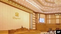 In this photo taken Sept. 21, 2011, members of parliament attend the second regular session of parliament at Hluttaw building in Myanmar's new capital Nay Pyi Taw. Myanmar's Parliament approved a law Thursday, Nov. 24, 2011 guaranteeing the right to prote