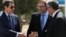 Greek Cypriot leader and Cyprus President Nicos Anastasiades (L) shake hands with Turkish Cypriot leader Mustafa Akinci (R), as UN envoy Espen Barth Eide looks on, in the buffer zone of Nicosia airport, Cyprus, Sept. 14, 2016.