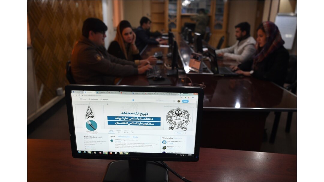 FILE - The Twitter page of Taliban spokesman Zabihullah Mujahid is pictured on a computer monitor in the newsroom at Maiwand TV station in Kabul, Feb. 6, 2019.