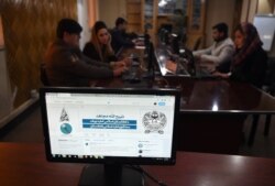 FILE - The Twitter page of Taliban spokesman Zabihullah Mujahid is pictured on a computer monitor in the newsroom at Maiwand TV station in Kabul, Feb. 6, 2019.