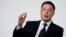 FILE - Elon Musk, co-founder of Tesla, speaks at a conference in Washington, July 19, 2017. Musk announced Friday that Tesla will remain a publicly traded company. 