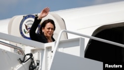 U.S. Vice President Kamala Harris waves as she boards Air Force Two for her first international trip as vice president to Guatemala and Mexico, at Joint Base Andrews, Maryland, June 6, 2021.