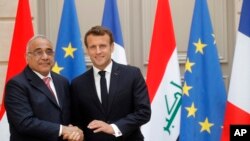 Rais wa Ufaransa Emmanuel Macron akiwa na Waziri Mkuu wa Iraq Adel Abdul-Mahdi Paris, Ufaransa, Mei 3, 2019. 