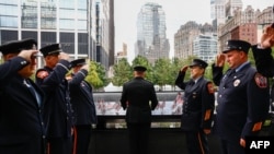 Fire Department of New York (FDNY) firefighters gather ahead of the the 25th anniversary commemoration of the September 11, 2001 attacks at the National September 11 Memorial in New York on September 11, 2026. (Photo by Jeenah Moon / POOL / AFP)
