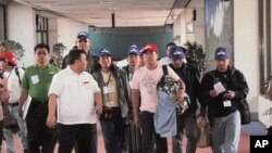 Philippine workers return home from Libya