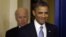 President Barack Obama smiles as he arrives with Vice President Joe Biden to make a statement regarding the passage of the fiscal cliff bill in the Brady Press Briefing Room at the White House in Washington, Janaury 1, 2013.