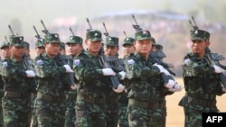 This handout from the Karen National Union (KNU) taken on January 31, 2019 and received on April 4, 2021 shows soldiers taking part in a parade for the 70th anniversary of the Karen revolution at a remote base on the Thai-Myanmar border