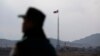 FILE - A North Korean flag flutters on top of a tower in Gijungdong, North Korea, in this picture taken near the truce village of Panmunjom.