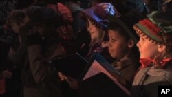 Children in London perform for the premiere for the latest movie version of Charles Dickens' "A Christmas Carol"