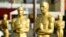 Oscar statues stand off of Hollywood Boulevard in preparation for Sunday's 92nd Academy Awards at the Dolby Theatre, Wednesday, Feb. 5, 2020, in Los Angeles. (AP Photo/Chris Pizzello)