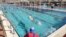 People swim at a pool where a 'Green Badge' is required to enter, as Israel reopens swathes of its economy, continuing to lift restrictions of a national lockdown to fight COVID-19, at Gordon Gym and Pool in Tel Aviv, Feb. 21, 2021.